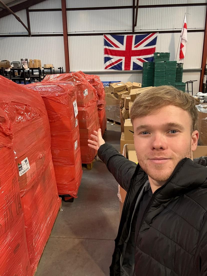 Scott in the warehouse with pallets